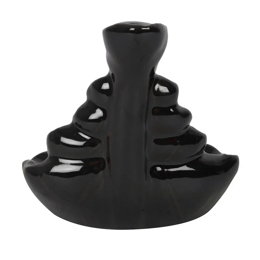 Zwarte keramische waterval wierookhouder, ideaal voor meditatie en ontspanning.
