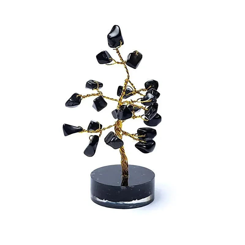 Zwarte obsidiaan kristallen boom op een ronde zwarte voet voor zen en meditatie