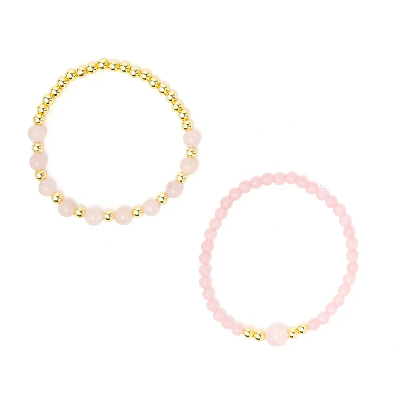 Roze en gouden armbanden van rozenkwarts, perfect voor zelfzorg en mindfulness