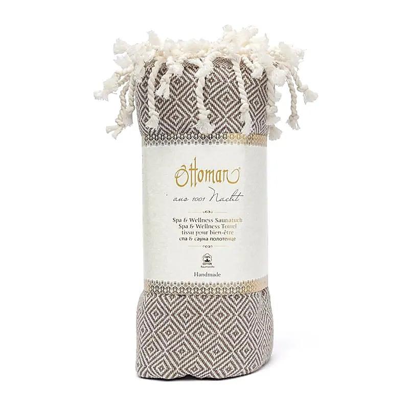 Handgeweven bruine hamamdoek met wit patroon en franjes, spa wellness handdoek.